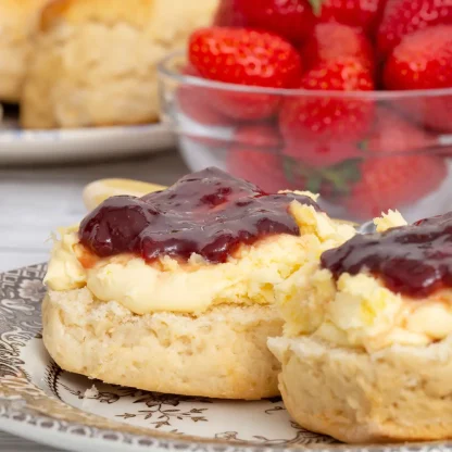 Scone topped with cream first